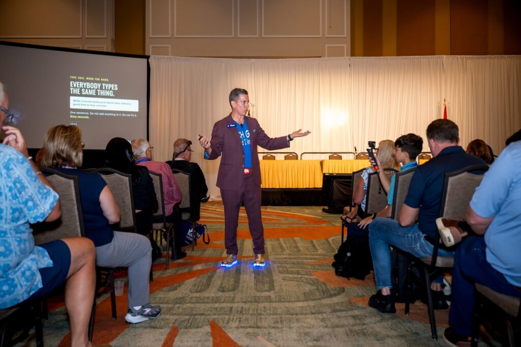 JMan delivering the Me, Myself and AI keynote at the Florida Realtors Convention, with a slide reading Everybody types the same thing